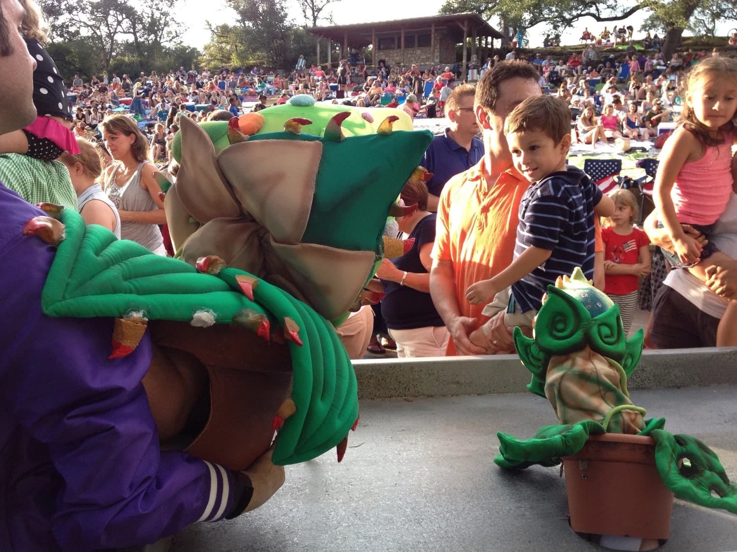 Costumed performers greeting families before a show at the Hillside Theater