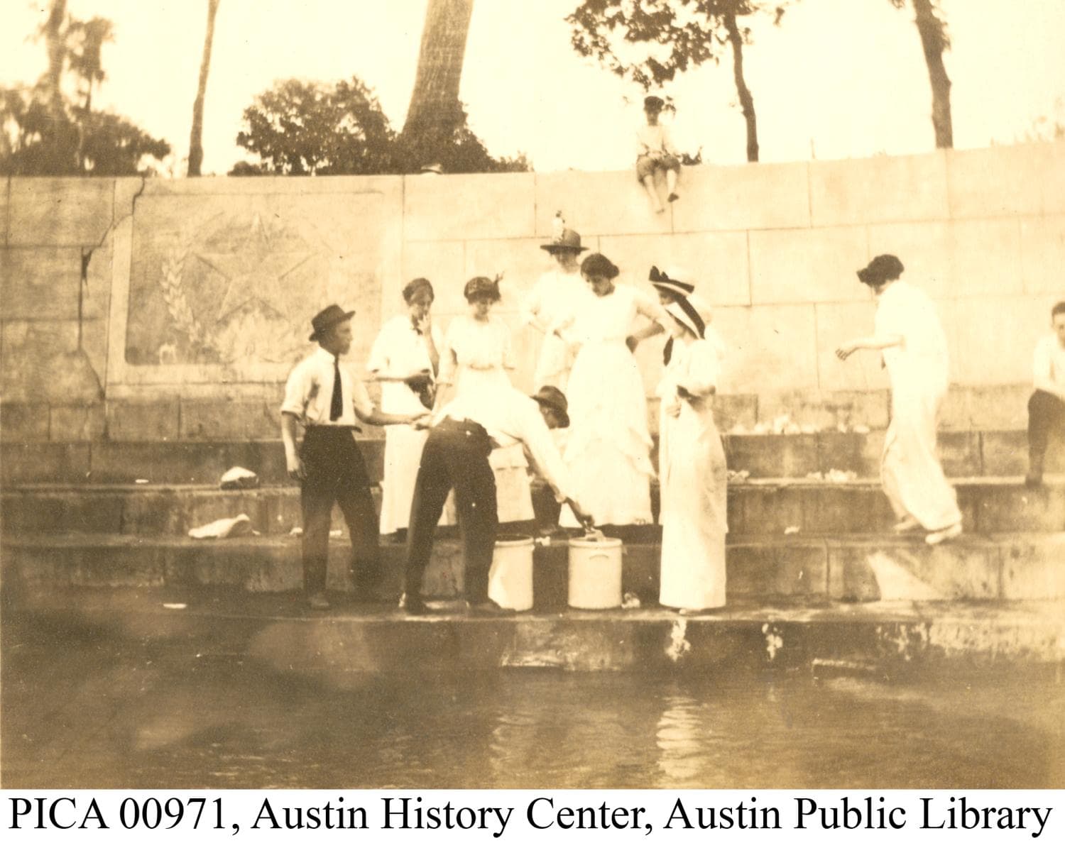 People gather water near Eliza Spring in the early 1900s.